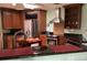 Kitchen with stainless appliances, a center island, dark countertops and light green walls at 6488 Robinswood Ave, Brooksville, FL 34602