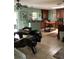 View of kitchen, showing dark wood cabinets, dining table and island at 6488 Robinswood Ave, Brooksville, FL 34602