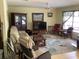 Cozy living room with a large window, plush seating, and a decorative rug at 6488 Robinswood Ave, Brooksville, FL 34602