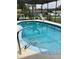 Inviting backyard pool with clear blue water and easy-access steps perfect for summertime relaxation at 6488 Robinswood Ave, Brooksville, FL 34602