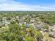 Home nestled amongst lush trees in a residential neighborhood, providing a serene and private setting at 6607 Larimer Dr, Tampa, FL 33615