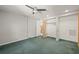 Bedroom features green carpet, ceiling fan and closet space at 6607 Larimer Dr, Tampa, FL 33615