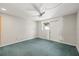 Spacious bedroom with ceiling fan, and door leading outside at 6607 Larimer Dr, Tampa, FL 33615