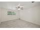 Bright bedroom with a window and a ceiling fan at 6607 Larimer Dr, Tampa, FL 33615