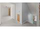 Upstairs hallway with stairs and closet for storage at 6607 Larimer Dr, Tampa, FL 33615