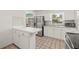 Bright kitchen boasts stainless steel appliances and tiled backsplash at 6607 Larimer Dr, Tampa, FL 33615