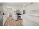 Bright kitchen features white cabinets, stainless steel appliances, and tile backsplash at 6607 Larimer Dr, Tampa, FL 33615