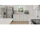 Bright kitchen with stainless steel refrigerator and a view from the window at 6607 Larimer Dr, Tampa, FL 33615