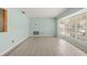 Bright living room with large window and neutral tile flooring; perfect for relaxation and entertaining at 6607 Larimer Dr, Tampa, FL 33615