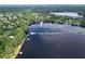 An aerial view showing waterfront access through the canal to Lake Pretty from the property at 7216 N Mobley Rd, Odessa, FL 33556