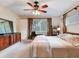 Bedroom features neutral tones and an open closet at 7216 N Mobley Rd, Odessa, FL 33556