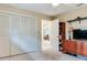 This bedroom features an closet, neutral color palette and a cozy atmosphere at 7216 N Mobley Rd, Odessa, FL 33556