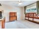 Comfortable bedroom features neutral walls, ceiling fan, and natural light at 7216 N Mobley Rd, Odessa, FL 33556
