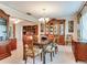 Dining room featuring a wooden table, chairs, and ornate hutch at 7216 N Mobley Rd, Odessa, FL 33556