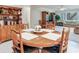 Cozy dining area featuring a round wood table and traditional furnishings for Gathering gatherings at 7216 N Mobley Rd, Odessa, FL 33556
