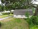 Charming guest house on a spacious, tree-lined property exudes character and tranquility at 7216 N Mobley Rd, Odessa, FL 33556