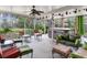 A screened patio features seating and a hot tub for relaxing and entertaining at 7216 N Mobley Rd, Odessa, FL 33556
