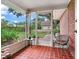 A view from a screened porch looks out to the yard at 7216 N Mobley Rd, Odessa, FL 33556