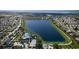 Stunning aerial view of a Primary-planned community with a large lake and resort-style amenities at 7610 Addison Ave, Bradenton, FL 34210
