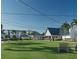 Expansive community lawn with benches and clubhouse in the background at 7610 Addison Ave, Bradenton, FL 34210