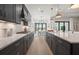 Open kitchen features ample counter space, modern appliances, and a seamless flow to the dining area at 7610 Addison Ave, Bradenton, FL 34210