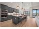 Modern kitchen with an island, stainless steel appliances, sleek cabinetry, and a large island at 7610 Addison Ave, Bradenton, FL 34210