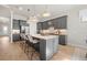Bright kitchen island offers bar stool seating and modern stainless-steel appliances at 7610 Addison Ave, Bradenton, FL 34210