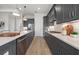 Modern kitchen equipped with stainless appliances, white countertops, and sleek gray cabinetry at 7610 Addison Ave, Bradenton, FL 34210