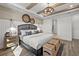 Spacious bedroom with neutral tones, a large bed, and elegant décor creating a relaxing atmosphere at 7614 Addison Ave, Bradenton, FL 34210