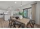 Elegant dining area with stylish table and chairs, open to the kitchen and living spaces at 7614 Addison Ave, Bradenton, FL 34210