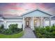 Charming single-story home featuring a welcoming front porch and attached two-car garage at 7614 Addison Ave, Bradenton, FL 34210
