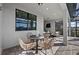 Covered patio featuring stylish outdoor seating, perfect for relaxing and entertaining guests at 7614 Addison Ave, Bradenton, FL 34210