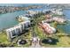 Gorgeous aerial view of waterfront condos, landscaped grounds, and boat marina, offering luxurious coastal living at 7922 Sailboat Key S Blvd # 608, South Pasadena, FL 33707
