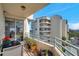 Balcony view features a dining table, plants, and an amazing view of the adjacent building at 7922 Sailboat Key S Blvd # 608, South Pasadena, FL 33707
