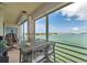 Balcony with a seating area overlooking a waterfront view, perfect for outdoor relaxation at 7922 Sailboat Key S Blvd # 608, South Pasadena, FL 33707