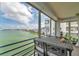 Balcony featuring outdoor seating and stunning views of the water and surrounding cityscape at 7922 Sailboat Key S Blvd # 608, South Pasadena, FL 33707