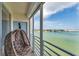 Cozy balcony with hanging chair offering panoramic waterfront views, ideal for relaxation at 7922 Sailboat Key S Blvd # 608, South Pasadena, FL 33707