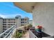 Condo balcony view of city features a dining table, plants, and a view of the water at 7922 Sailboat Key S Blvd # 608, South Pasadena, FL 33707