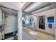 A main bathroom features granite countertops, mirrored walls, and a shower with glass doors at 7922 Sailboat Key S Blvd # 608, South Pasadena, FL 33707