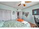 Bedroom includes ceiling fan, built-in shelving, closet, and modern furniture at 7922 Sailboat Key S Blvd # 608, South Pasadena, FL 33707