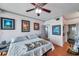Comfortable bedroom with neutral decor, artwork, and hardwood flooring throughout at 7922 Sailboat Key S Blvd # 608, South Pasadena, FL 33707