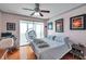 A lovely main bedroom with a ceiling fan, a modern desk, and access to an outdoor balcony at 7922 Sailboat Key S Blvd # 608, South Pasadena, FL 33707