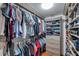 A brightly-lit walk-in closet provides ample storage with shelves, drawers, and hanging racks at 7922 Sailboat Key S Blvd # 608, South Pasadena, FL 33707