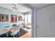 Bright dining room featuring modern furniture, unique artwork, and access to outdoor balcony at 7922 Sailboat Key S Blvd # 608, South Pasadena, FL 33707