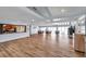Large event space featuring a kitchen area, hardwood floors, and expansive windows for bright, airy events at 7922 Sailboat Key S Blvd # 608, South Pasadena, FL 33707