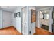 Inviting hallway with hardwood floors and access to bathroom at 7922 Sailboat Key S Blvd # 608, South Pasadena, FL 33707