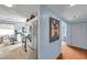 Modern kitchen featuring stainless steel appliances and tile floors, adjacent to a bright hallway with light blue walls at 7922 Sailboat Key S Blvd # 608, South Pasadena, FL 33707