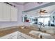 Bright kitchen features granite countertops, white cabinetry, and an undermount sink at 7922 Sailboat Key S Blvd # 608, South Pasadena, FL 33707