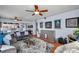 Spacious living room features hardwood floors, ceiling fans, and seamless flow into the kitchen at 7922 Sailboat Key S Blvd # 608, South Pasadena, FL 33707