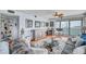 Inviting living room with stylish decor, a glass coffee table, and access to the outdoor balcony at 7922 Sailboat Key S Blvd # 608, South Pasadena, FL 33707